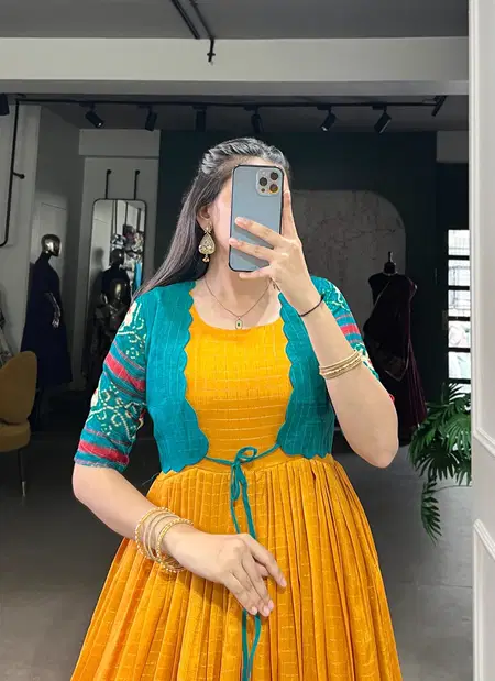 YNF 5028 MST Tasar Chex Patola Print With Weaving Work Border Gown With Koti Wholesale In India